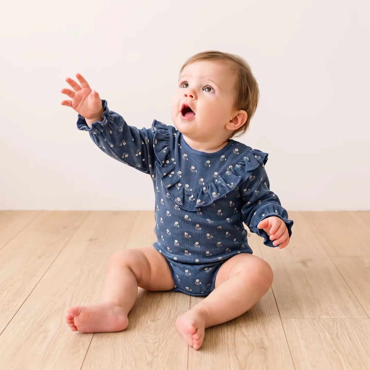 INDIGO BLOOM ORGANIC RUFFLE BUBBLE ROMPER
