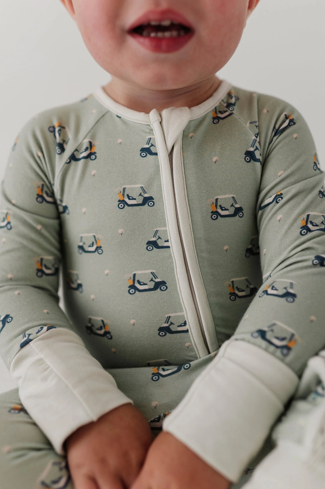 GOLF CART LONG SLEEVE ZIP ROMPER